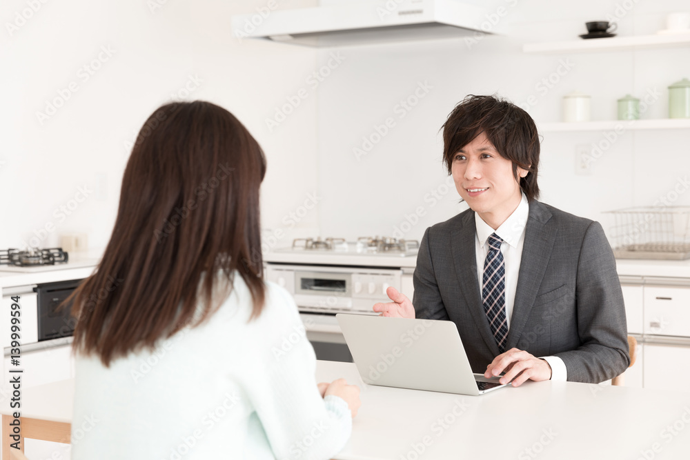 asian businessman talking in kitchen