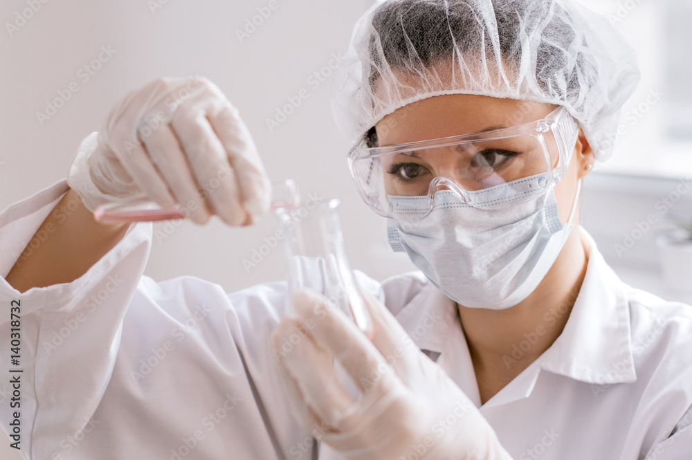 Scientist looking at test tube in the laboratory at the university