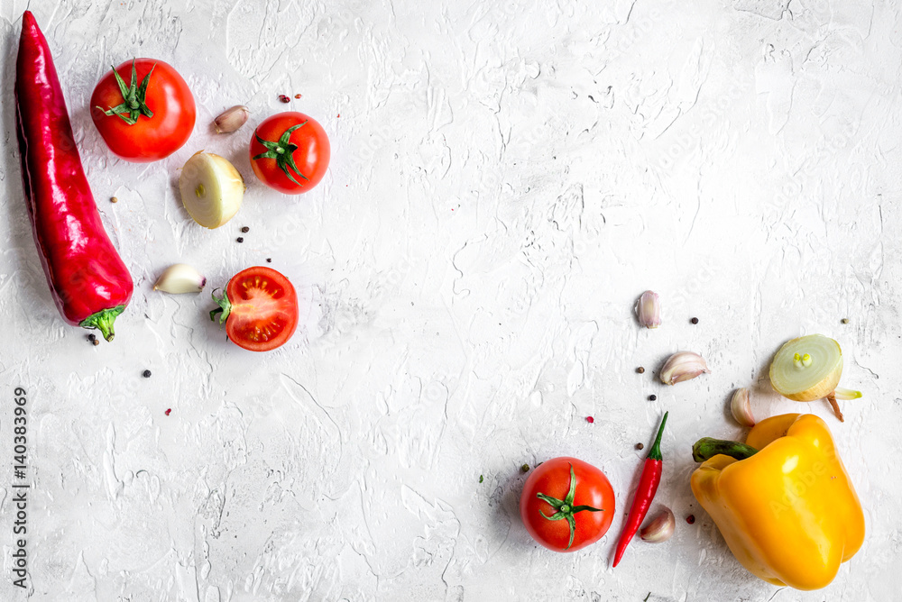 cooking vegetables on the stone background top view