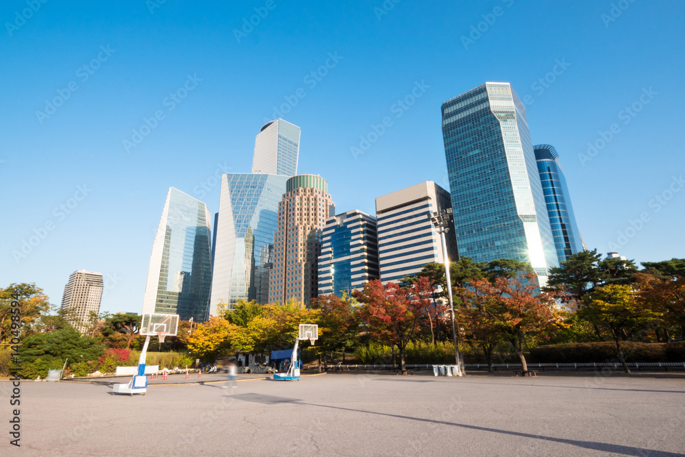 empty basketball court near modern buildings