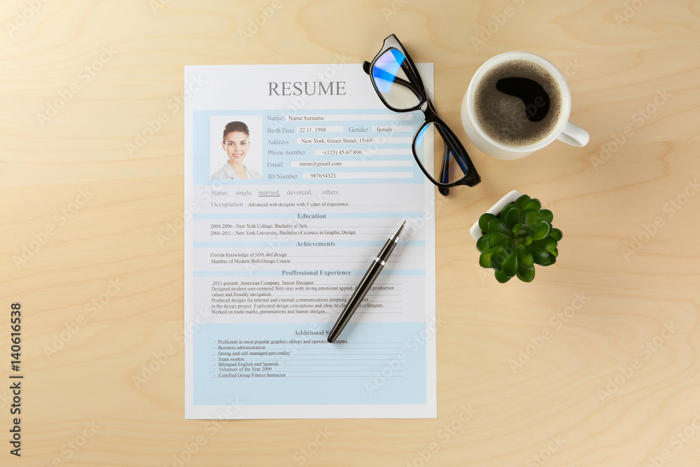 Resume form and cup of coffee on office table