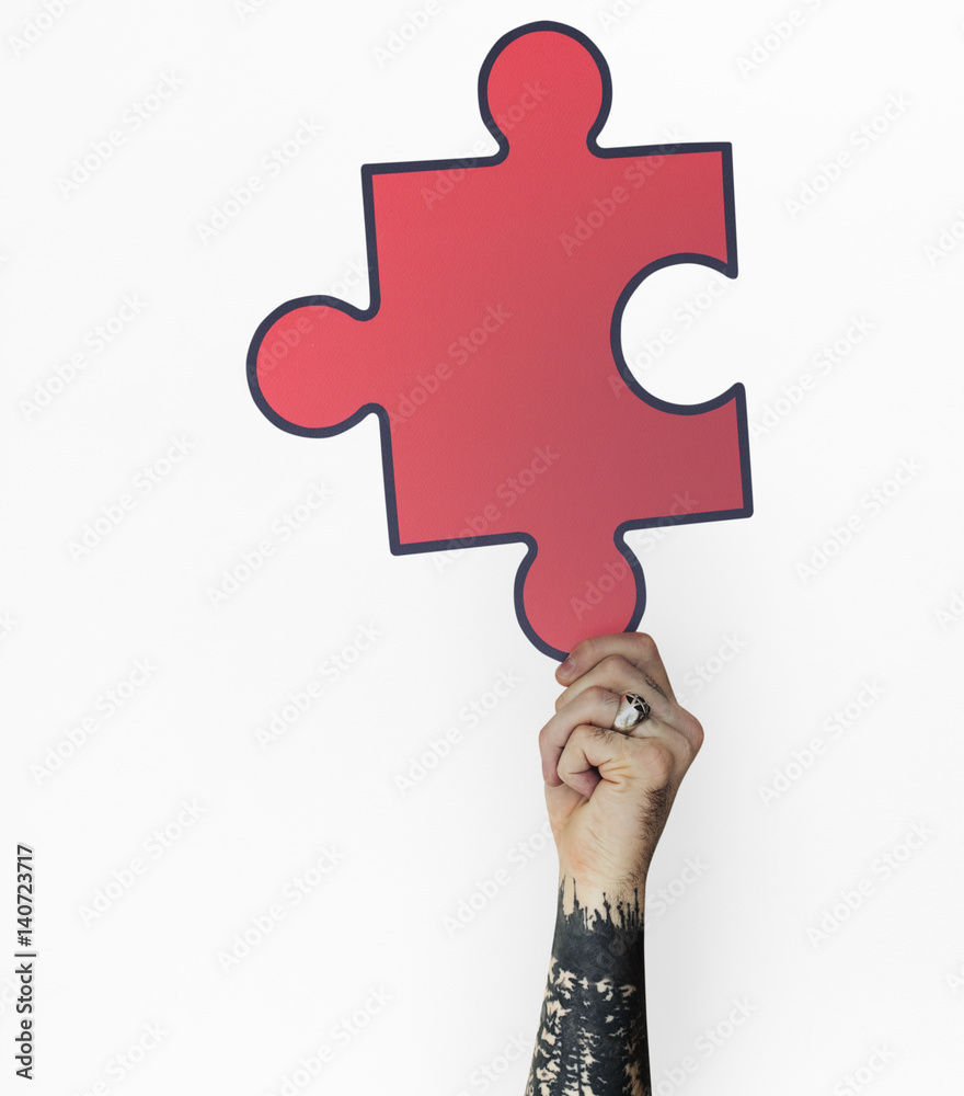 Human Hand Holding Jigsaw Puzzle