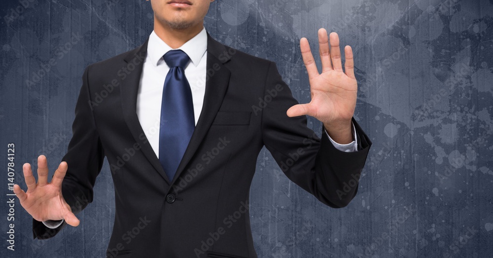 Composite image of Businessman Torso against dark background