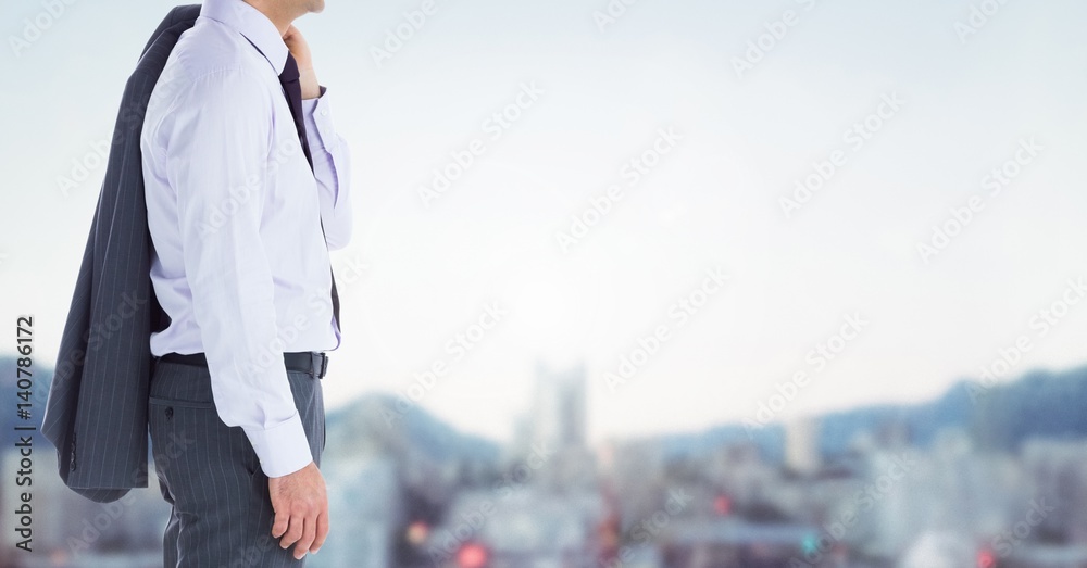 Composite image of Businessman Torso against blurry landscape