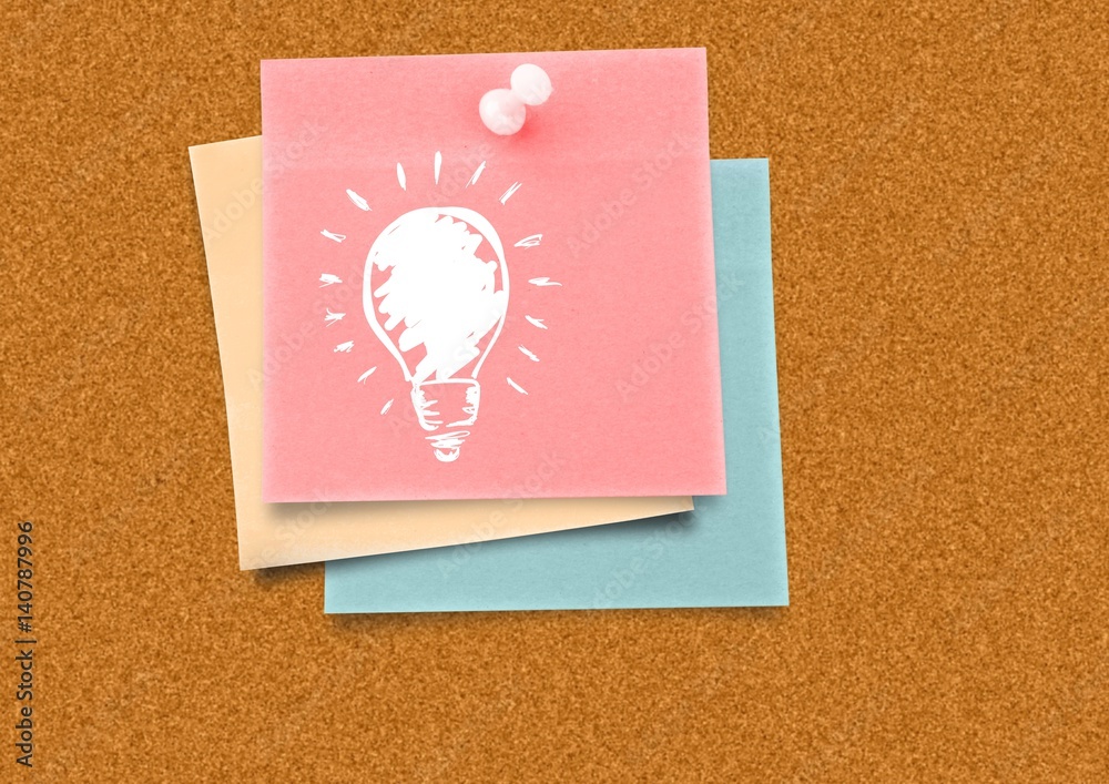 Sticky Note with Light bulb Idea against a board