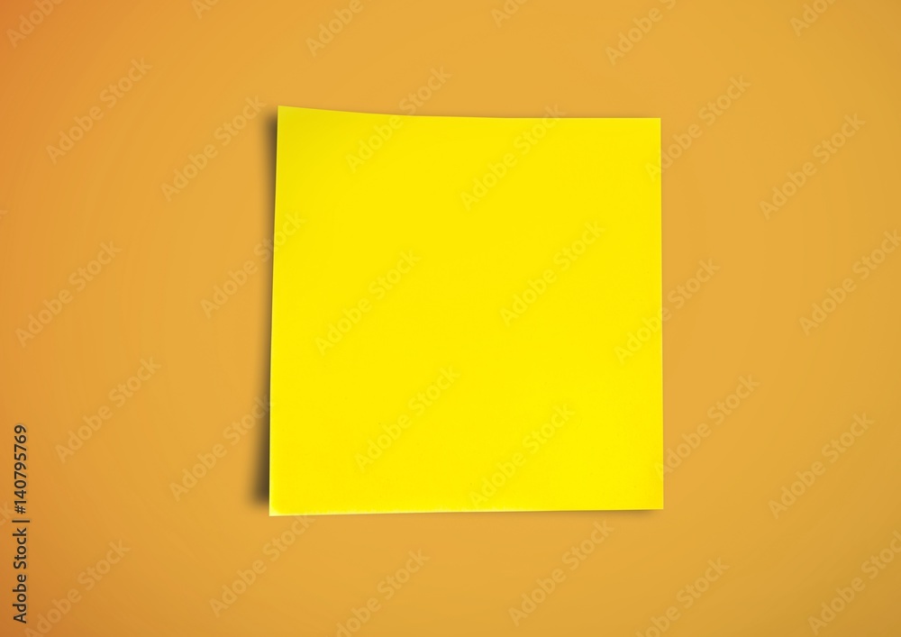 Yellow sticky Note against a neutral orange background