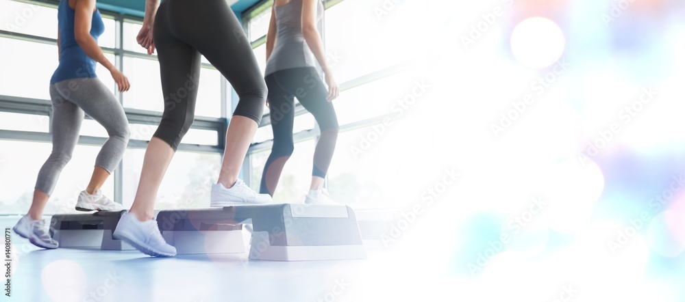 Composite image of three women doing aerobics