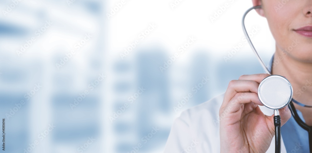 Composite image of close-up of female doctor holding stethoscope