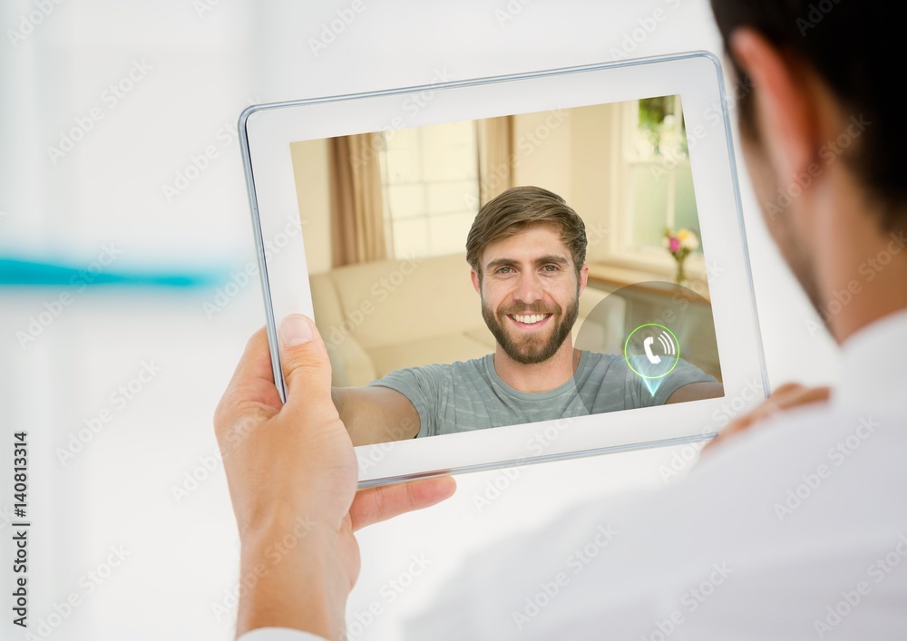 Man having a video call with his friend on digital tablet