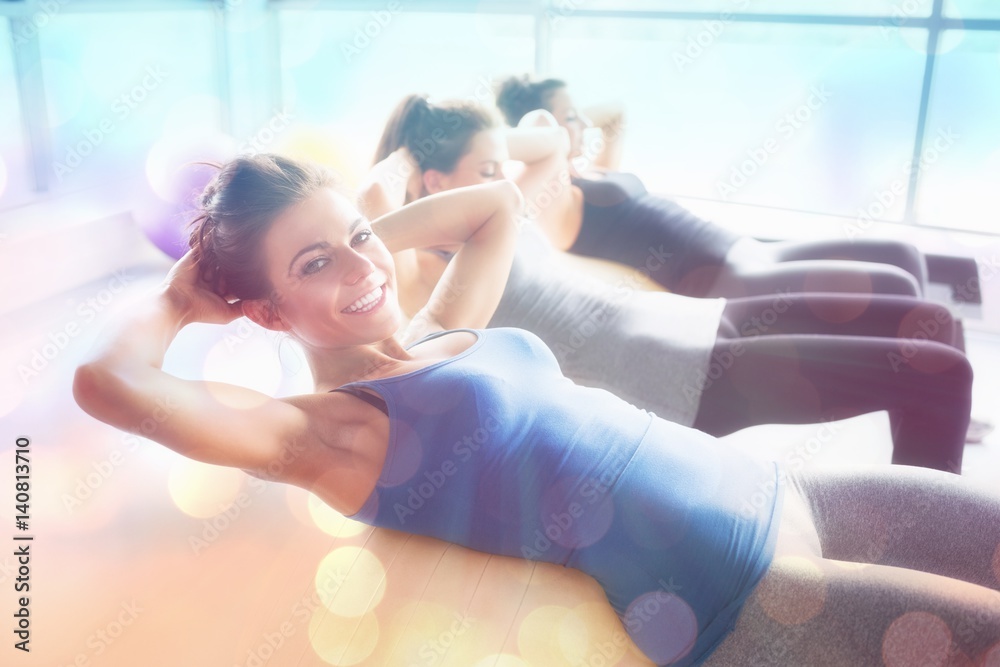 Composite image of women doing situps