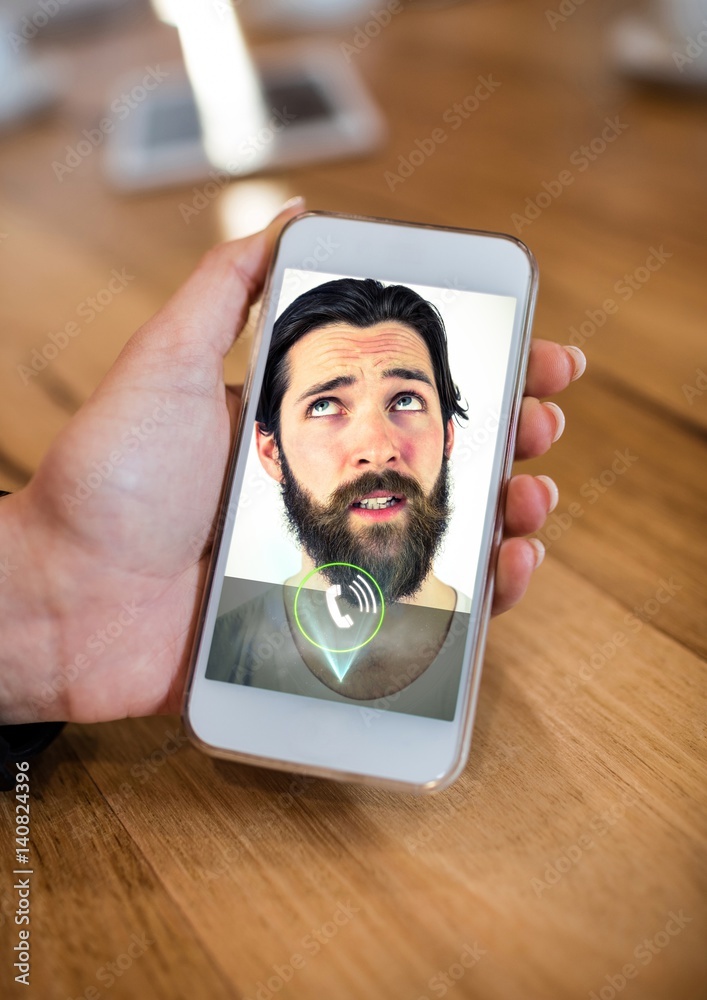 Hand of woman having video calling on mobile phone