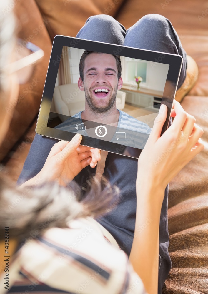 Woman having video calling on digital tablet