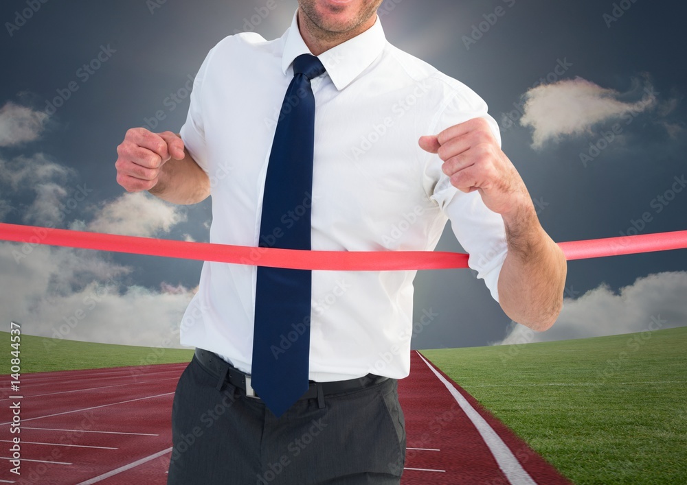 Digital composite image of a businessman winning the race