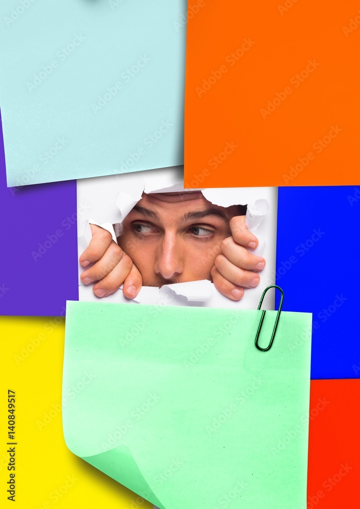 Man peeking through sticky notes