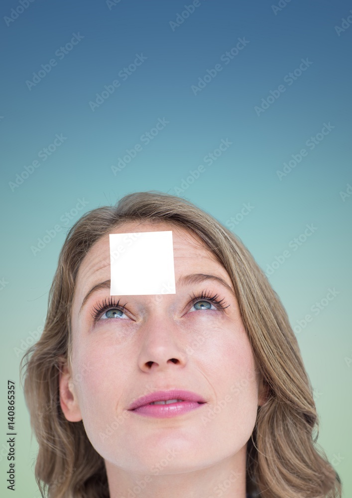 Woman with blank sticky note on forehead