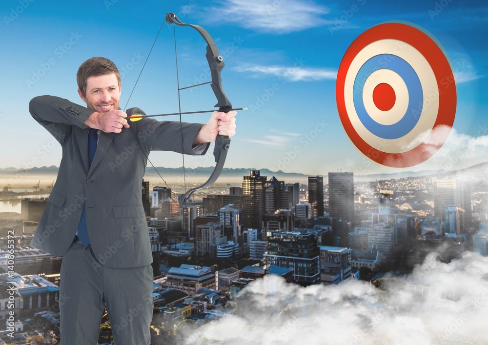 Businessman aiming with bow and arrow at target over cityscape