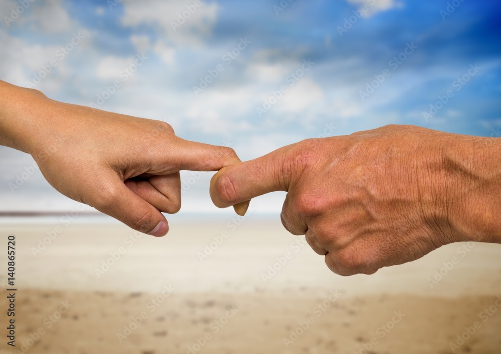 Close-up of male and female hands holding fingers 