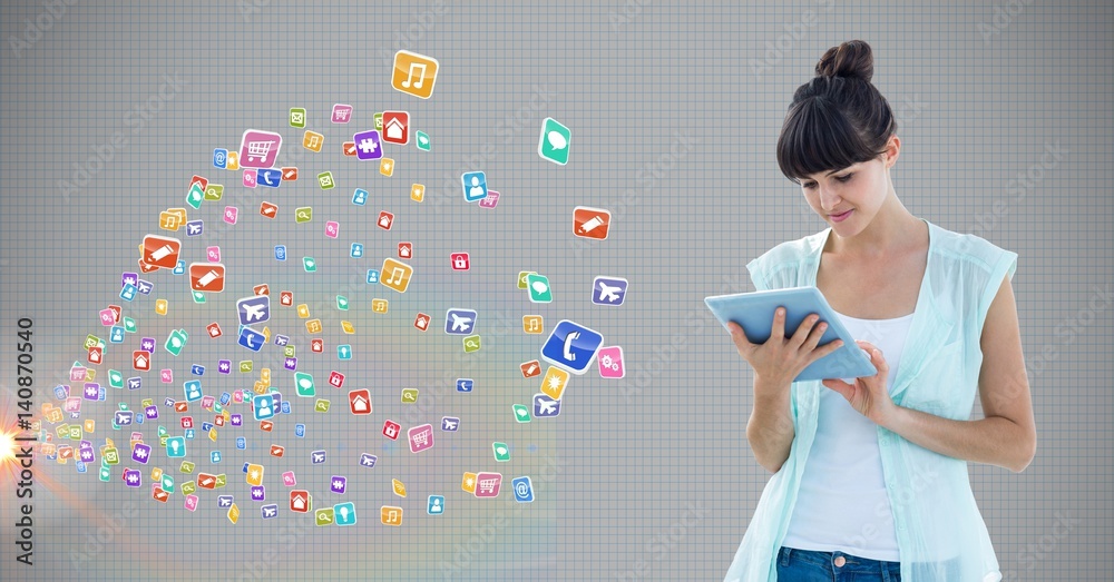 Woman using digital tablet against application icons