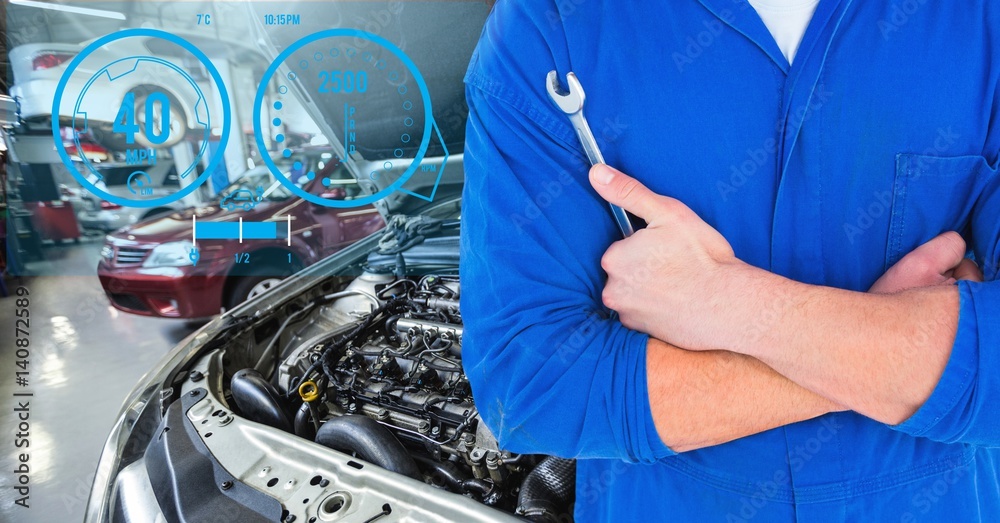 Mechanic holding lug wrench in car repair garage