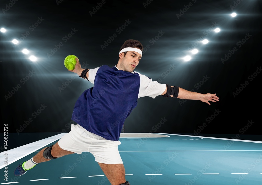 Male athlete playing handball in stadium