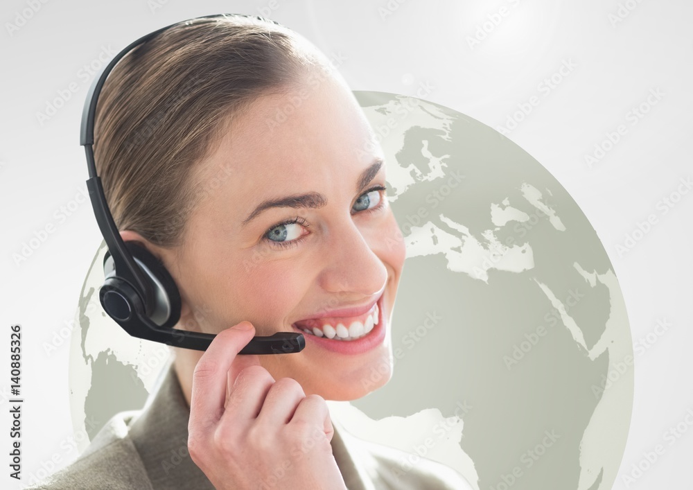 Happy woman talking on headset with globe in background