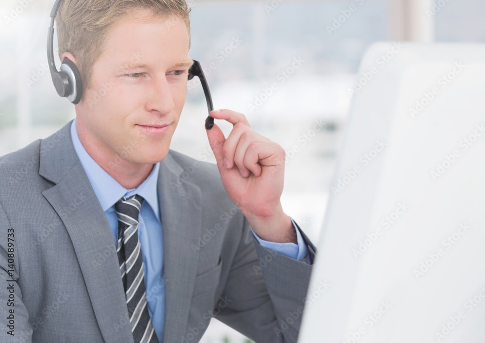 Customer service executive working at desk