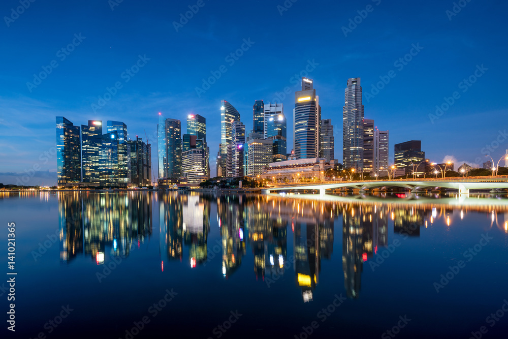 Singapore business district skyline in night at Marina Bay, Singapore.