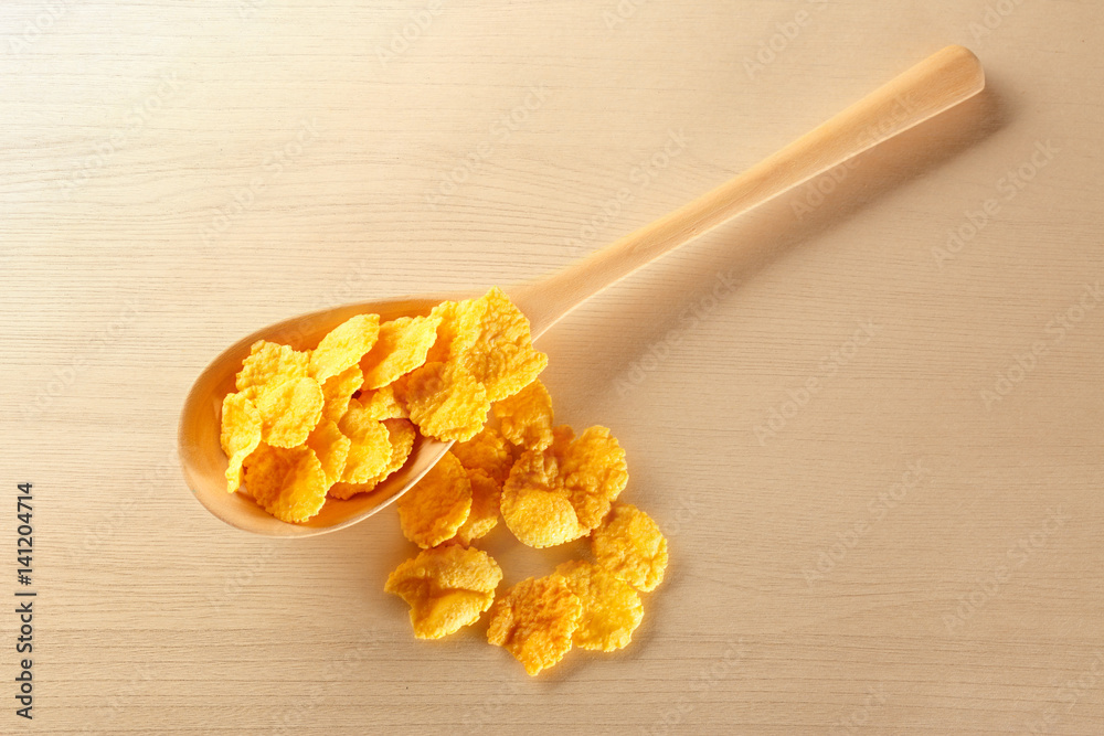 Wooden spoon with corn flakes