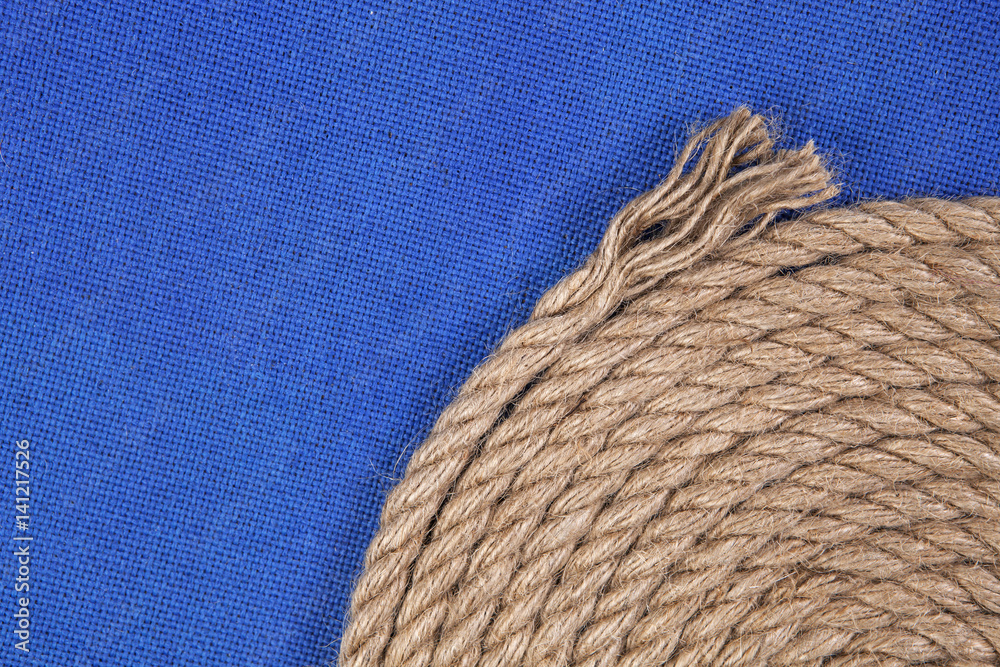 Ship rope on blue background, top view with copy space