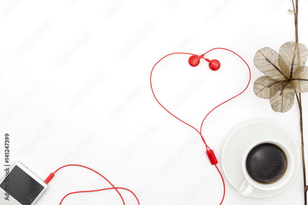 coffee cup with music player and earphone on white background