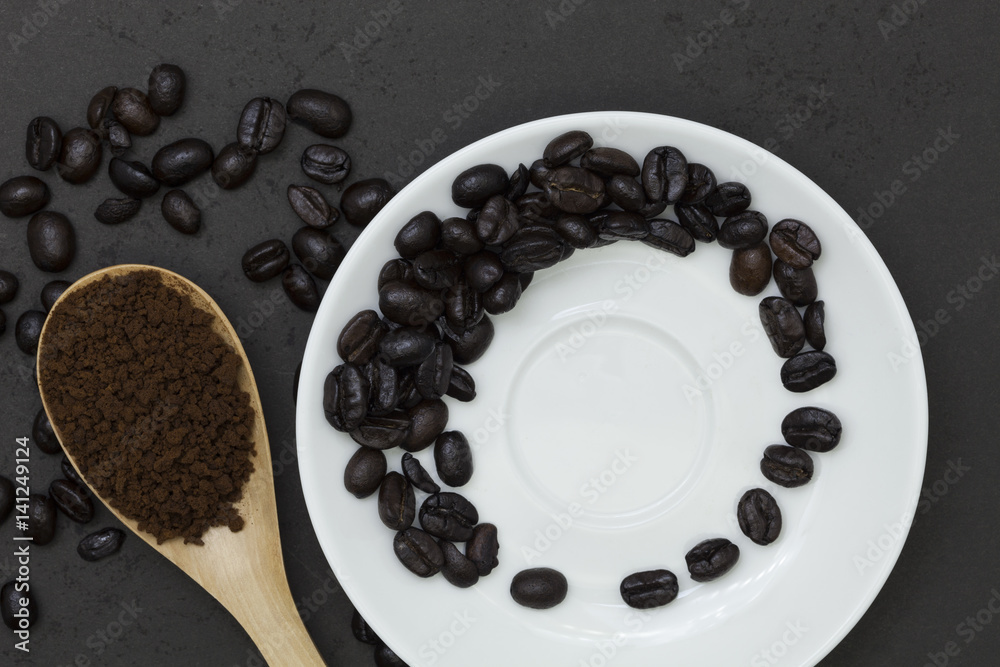 coffee beans on dark black background.