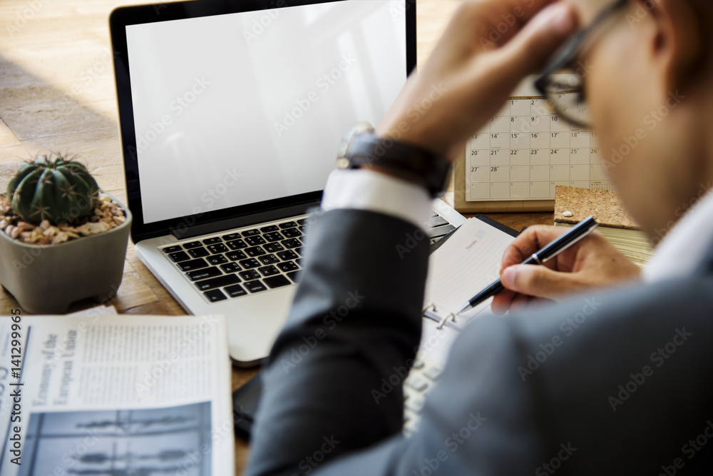 Businessman Working Writing On A Wooden Table