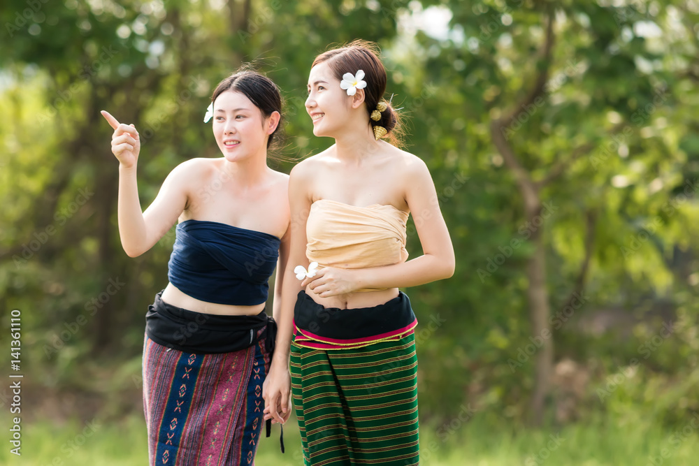 Lao women wear traditional dress at countryside.