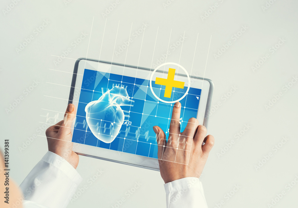 Close of female doctor hands working with tablet pc computer