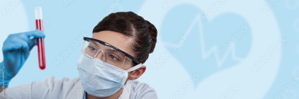 Composite image of female scientist holding test tube