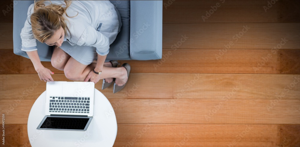 Composite image of woman on her laptop