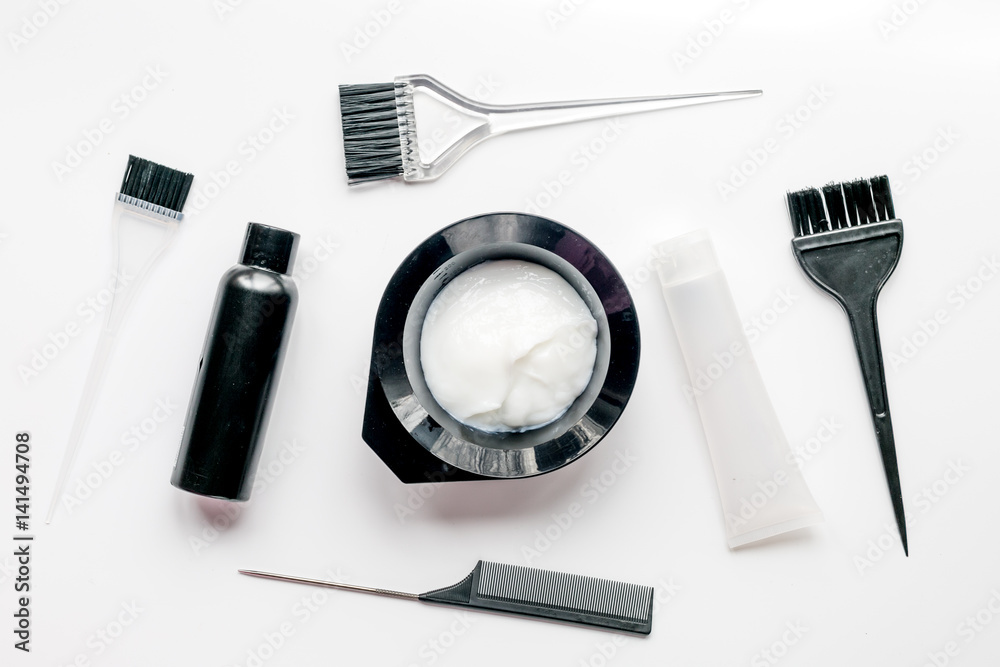 Tools for hair dye in barbershop on white background top view