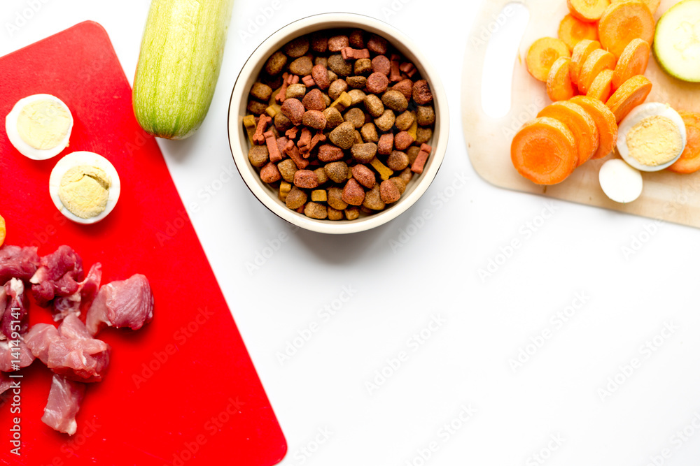 healthy dogfood with eggs, vegetables and meat on kitchen top view mockup