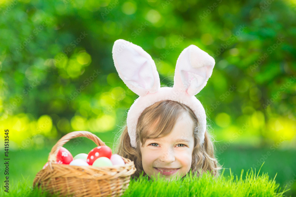 Easter bunny and eggs on green grass