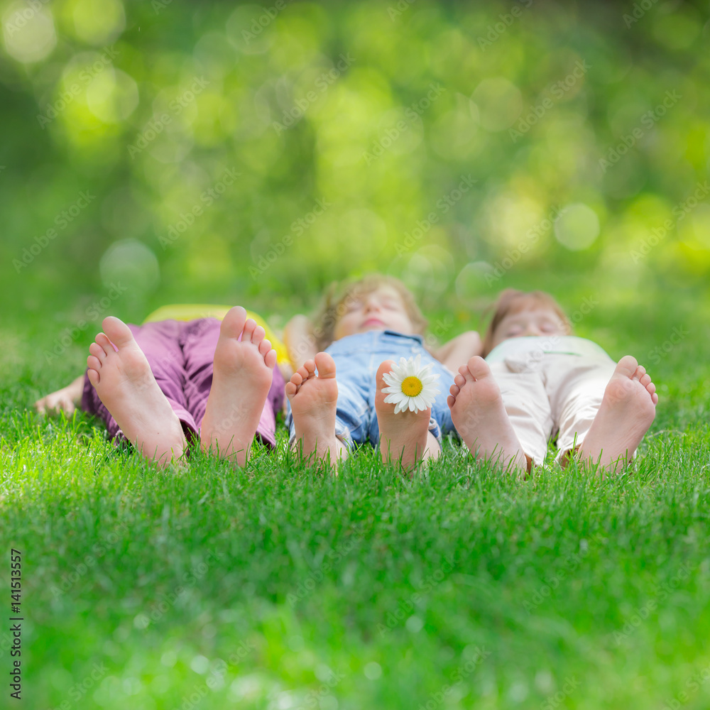 Group of happy children playing outdoors