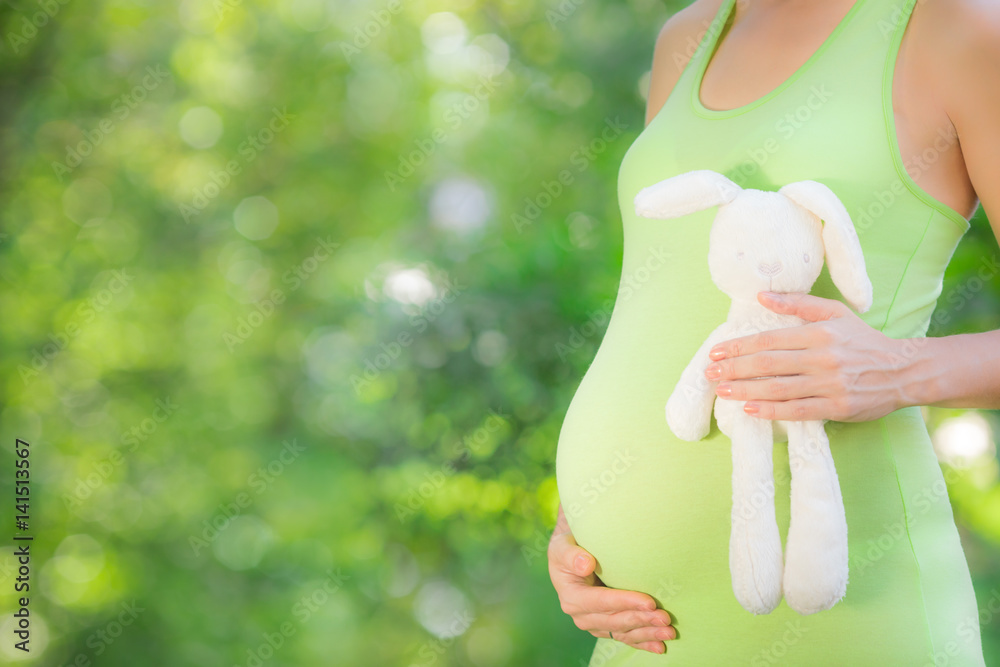 Beautiful belly of young pregnant woman