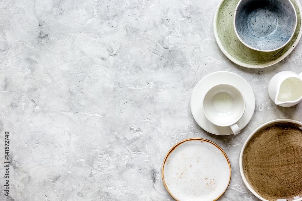 ceramic tableware top view on stone background mock up