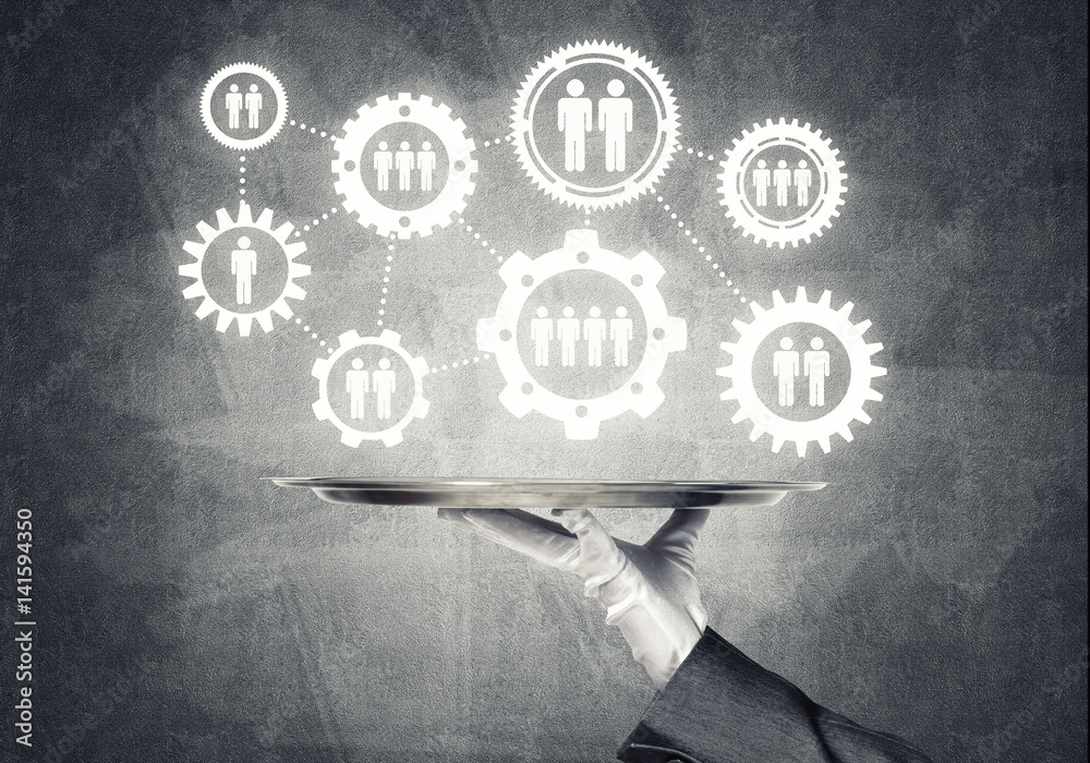 Waiter hand with white gloves holding silver plate full of social media communication icons