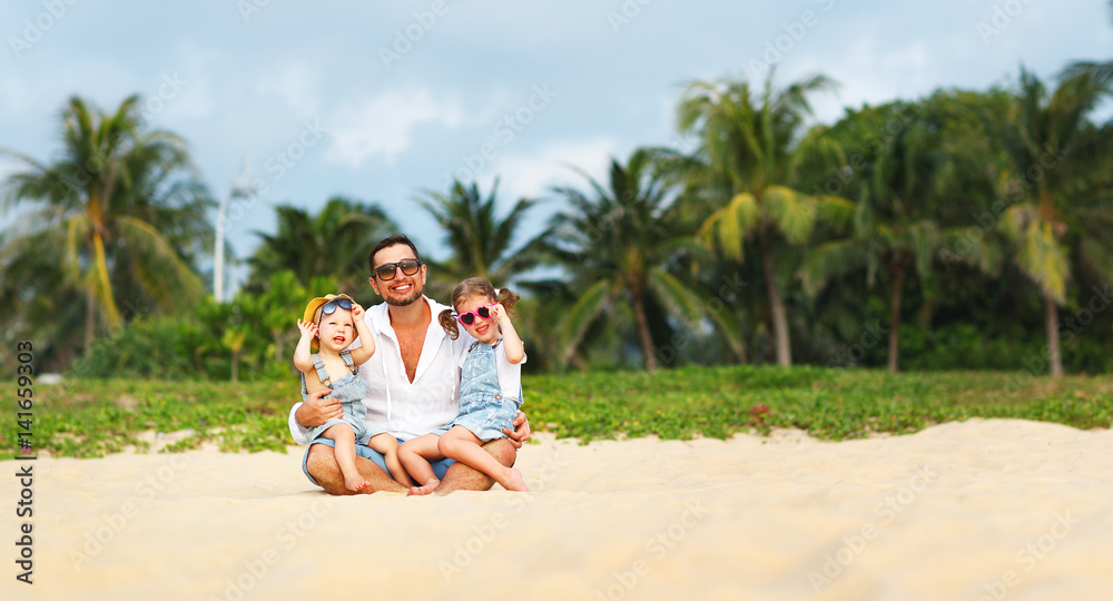 fathers day. Dad and children playing together outdoors on a summer