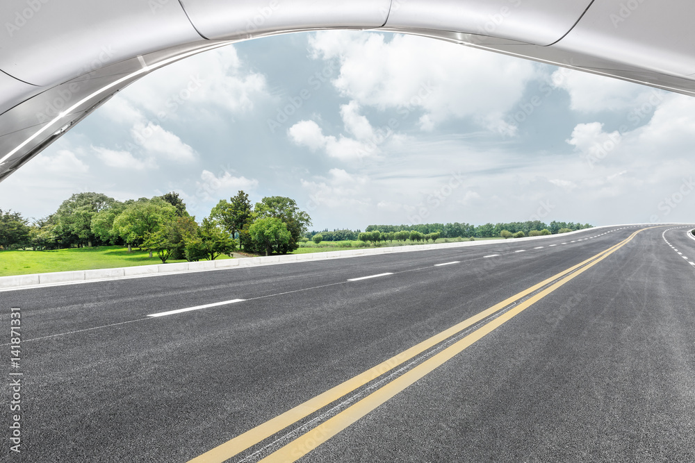 Asphalt road and modern building landscape