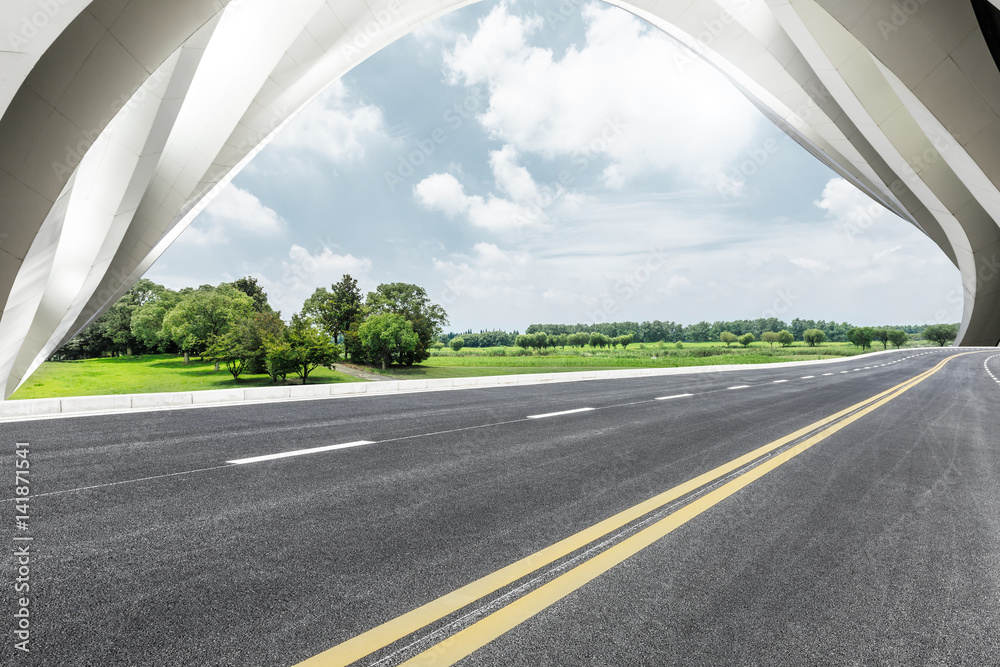 Asphalt road and modern building landscape