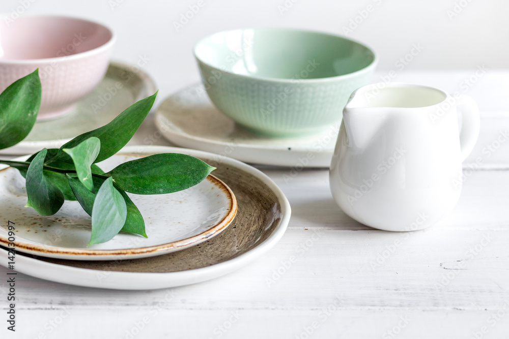 ceramic tableware with flowers on white background