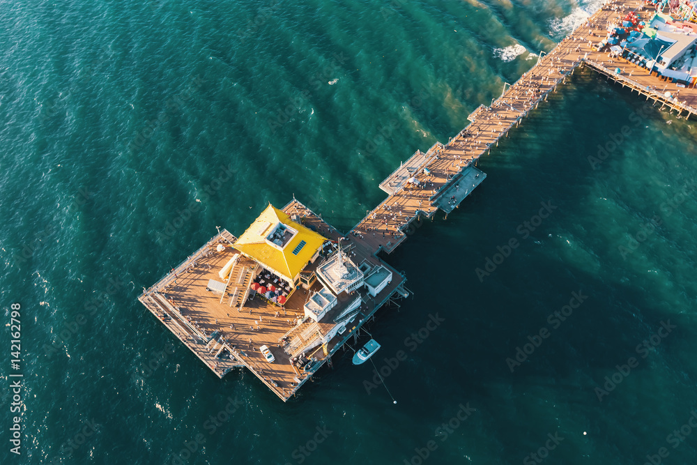 Aerial view of a pier on the California coast