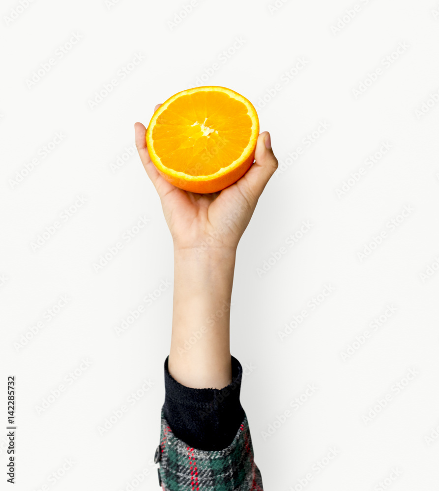 Hand Holding Orange Isolated Concept