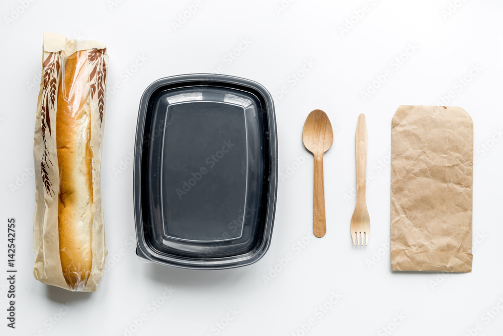 take away with sandwich and paper bags on table background top view